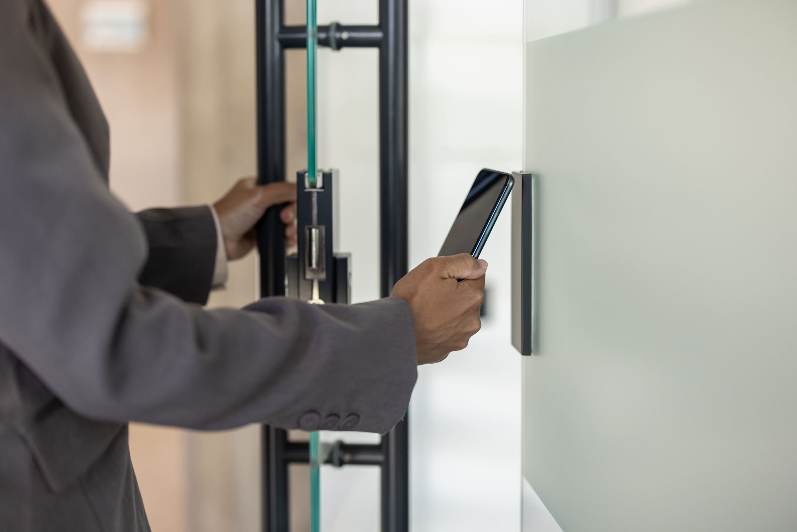 employee at modern corporate facility using access control